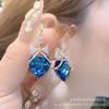 Clip para la oreja sin agujero para la oreja para mujer, aretes retro con borla, aretes de perlas de alto sentido, clip para la oreja de temperamento de lujo ligero al por mayor