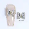 Arte de Uñas Cristal Mariposa Diamante Joyería Super Brillante Hielo Transparente Color Aurora Popular en Internet Venta Caliente Decoración de Uñas Metálica Tridimensional