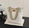 Bolso de mujer 2026 nuevo modelo de lona para escuela y para ir al trabajo, bolso tote de nicho de gran capacidad para portátil, bolso de lona