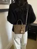 Bolsas pequeñas populares de comercio exterior para mujer 2026 nuevo bolso de moda versátil para hombro y cruzado, bolso de mano de cubo de alta calidad de moda
