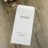 Zapatillas de Hotel Personalizadas y Bolsa Antipolvo para Almacenamiento de Artículos de Cuero Bolsa de Cordón No Tejido Bolsillo con Solapa de Cordón No Tejido Pantalones con Estampado de Logo