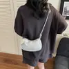 Bolso de axila de nicho coreano para mujer 2026 Nuevo de moda con encaje en forma de media luna Bolso de hombro simple