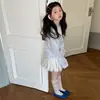Conjunto de Ropa de Verano para Niñas 2026 Nueva Camiseta Rayada de Seda Helada Protectora del Sol y Conjunto de Falda de Dos Piezas de Moda para Niños