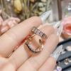 Pendientes de estilo coreano Camellia, ligeros, de lujo, con gemas de girasol clásicas, chapados en oro rosa, con incrustaciones de diamantes europeos y americanos, con nota hueca