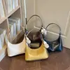 Bolsa de ombro e transversal texturizada transfronteiriça para mulheres, novo modelo 2026, simples, em formato de meia-lua