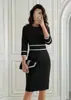 Vestido Social de Cruzada Europea y Americana 2026 Estilo Pequeña Fragancia Cuello Redondo Manga Siete Botones Bolsillo Falso Ajustado al Cuerpo Bodycon para Socialité y Commuter
