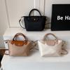 Bolso Retro de Primavera y Verano Bolso Cubo 2026 Diseño de Nicho de Moda Bolso de Nylon para Mujer Versátil Hombro Cruzado Bolso Dumpling