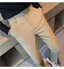 Calças de terno casual waffled Calças masculinas de primavera e outono Calças de terno de negócios Slim-fit Pés magros Calças de terno de cintura elastómica sem engomar