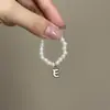 Mini Labubu Cuarta Generación Caja Sorpresa Ropa de Muñeca Collar Colgante Labubu 26 Letras Collar de Perlas Accesorios de Joyería