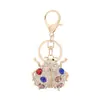 Llavero de mariquita de color diamante para coche de dama europea y americana, llavero de animal de aleación de zinc, colgante para bolso, venta al por mayor