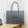 Nova bolsa de feltro não tecido costurada bolsa pequena de feltro grande capacidade sacola de mão para presente sacola de presente com LOGOTIPO impresso