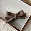 Moda Coreana Clip para el Cabello de Lazo de Doble Cara Tejido Etiqueta Dorada Clip Banana Clip para Cola de Caballo Accesorios de Alta Gama para el Cabello para Mujeres