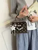 Bolso Cuadrado Pequeño Nuevo Estilo Coreano Otoño 2026 con Lunares y Cierre de Candado para Mujer Bolso de Hombro Cruzado Versátil Nuevo 2026