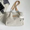 Bolsa feminina 2026 outono nova estilo coreano bolsa escolar estudantil simples moda bolsa de ombro grande capacidade bolsa tote para o dia a dia