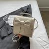 Mochila Coreana de Nicho com Laço 2024 Moda Nova Mochila de Viagem Pingente de Pérola de Alta Qualidade Bolsa Escolar Universitária
