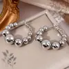 Pendientes de Bolas Redondas con Gradiente Xiyin de Venta Caliente Transfronterizos Europeos y Americanos Pendientes Exagerados Elegantes y de Moda