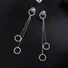 Comercio electrónico transfronterizo Japón y Corea del Sur suministran joyería moda de moda círculo para mujer borla pedrería garra cadena pendientes completos línea de oreja E651