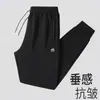 Calça esportiva casual masculina nova e moderna de outono, com bolsos, tamanho grande, calça jogger com zíper, calça de moletom de perna reta