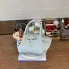 Bolso tipo cubo versátil y de alta gama con patrón de lichi para mujer, nuevo diseño de principios de primavera 2026, bolso de mano y bolso cruzado únicos y exquisitos