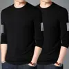 Camiseta elástica de manga larga para hombre, corte holgado, adecuada para primavera y otoño, color liso, versátil, se puede usar como atuendo de pareja, capa interior para hombre
