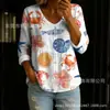 Nova camisa feminina transfronteiriça estampada de manga longa com botões e decote em V, elegante e estilosa para o trabalho, blusa casual única e da moda