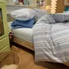 Nuevo juego de cuatro piezas de gasa de doble capa, funda de edredón amigable con la piel, juego de tres piezas para dormitorio de estudiante, funda de almohada y sábana para el hogar
