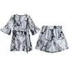 Conjunto de dos piezas con estampado estilo Stylike para mujer talla grande, reduce la edad, estilo nuevo de verano 2024, pantalones de pierna ancha adelgazantes para chicas rellenitas