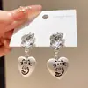 Pendientes de plata con colgante de gato estilo coreano ins, pendientes de nicho de lujo ligero de alta gama para mujer, bonitos pendientes para el día a día del commute