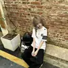Bordado en la parte delantera, estampado en la parte traseraCamiseta de manga corta estilo callejero americano para hombre y mujer, corte holgado con diseño de rayas, top de marca a la moda