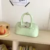 Bolsa de mano para mujer estilo coreano, nicho, simple y elegante, para ir al trabajo, verano 2026, bolso de mano de alto valor, moderno y elegante, tipo concha