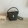 Bolso pequeño súper popular para el trabajo, nuevo bolso de moda otoño 2026 para mujer, bolso tipo cubo retro para hombro cruzado, para commuting