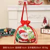 Saco de maçã de Natal transfronteiriço Saco de presente de flanela com desenho animado bronzeado com laço Sacola de presente de doces para crianças