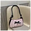 Bolso Media Luna de Color Contrastante Negro y Rosa con Lazo Súper Popular para Mujer 2025 Verano Nueva Moda Versátil Estilo Extranjero Bolso Bandolera de un Solo Hombro