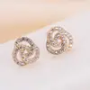 Aretes de moda europeos y americanos para mujer, aretes de flor y diamante, aretes geométricos de metal simples con temperamento, fabricantes de joyería en stock