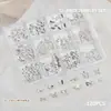 Accesorios para Uñas Artísticas Caja de 12 Compartimentos Mariposa Metálica Mixta Cuervo Corazón Cruz Cinta Lazo Decoración para Uñas de Forma Especial