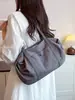 Bolsa de Ombro Grande Capacidade Transfronteiriça para Mulheres 2026 Nova Tendência Estilo Coreano Bolsa Tote para o Dia a Dia Cor Sólida Versátil Bolsa de Mão Bolsa de Ombro