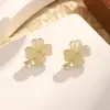 Han Feng aretes de piedra ojo de gato aretes de lazo hueco de circón aretes joyería pura para niñas al por mayor