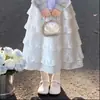 Elegante y dulce conjunto de dos piezas para niños mayores, con un top de diseño vanguardista de imitación de dos piezas combinado con una falda de encaje