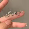 Uña de Oreja con Borla Anillo Saturno de Circonita Ultra-flash Diseño de Sentido de Lujo Ligero Elegante Moda Elegante Uña de Oreja Versátil de Moda