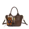 Bolsas Femininas da Moda para Este Ano: Elegante Retrô Textura Simples Versátil Bolsa de Mão Saco de Balde para o Trabalho Nicho Elegante Bolsa Transversal