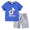 Camiseta infantil 2022 TikTok verano nueva ropa infantil de comercio exterior coreana pantalones cortos de manga corta para niños traje de dos piezas