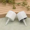 Boquilla rociadora de tipo a presión, de 32 dientes, snap-on, en stock del fabricante, boquilla aislante para spray de protección solar, forma de huevo, hecha de material PP