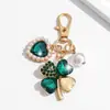 Llavero de Trébol de Cuatro Hojas con Pedrería Moda Europea y Americana Transfronteriza Colgante de Perla en Forma de Corazón Accesorios para Llavero de Bolso de Niña