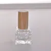 Venta al por mayor de fábrica 10 ml Decantador de perfume Mini tapa de madera maciza Portátil para viajes Botella de perfume Atomizador de niebla fina Botella de vidrio vacía