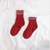 Nuevos calcetines de otoño e invierno gruesos cálidos de hilo grueso con puño dos o dos rayas calcetines de tubo de hilo grueso para mujer
