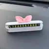 Lindo letrero de número de teléfono para estacionar con un moño, un permiso de estacionamiento creativo y elegante para tu coche, una decoración interior para cuando estés estacionado