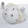 Directo de fábrica simulación novia hecha a mano sosteniendo flores estilo coreano explosiones boda dama de honor boda foto accesorios foto