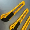 Cuchillo de utilidad al por mayor del fabricante Comercio exterior Cúter de oficina Cúter de papel Cúter de pared Cúter de caja Hoja de utilidad portátil