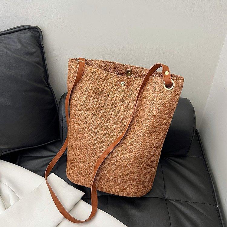 编织包女包新款潮2024夏草编简约百搭小清新水桶包个性单肩斜