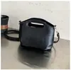Bolso de cubo de cuero para mujer, modelo nuevo 2025, bolso de hombro de nicho de alta gama, bolso cruzado versátil vintage para el día a día